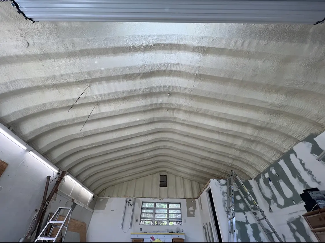 Spray polyurethane foam applied to the underside of a metal roof deck in Pittsford